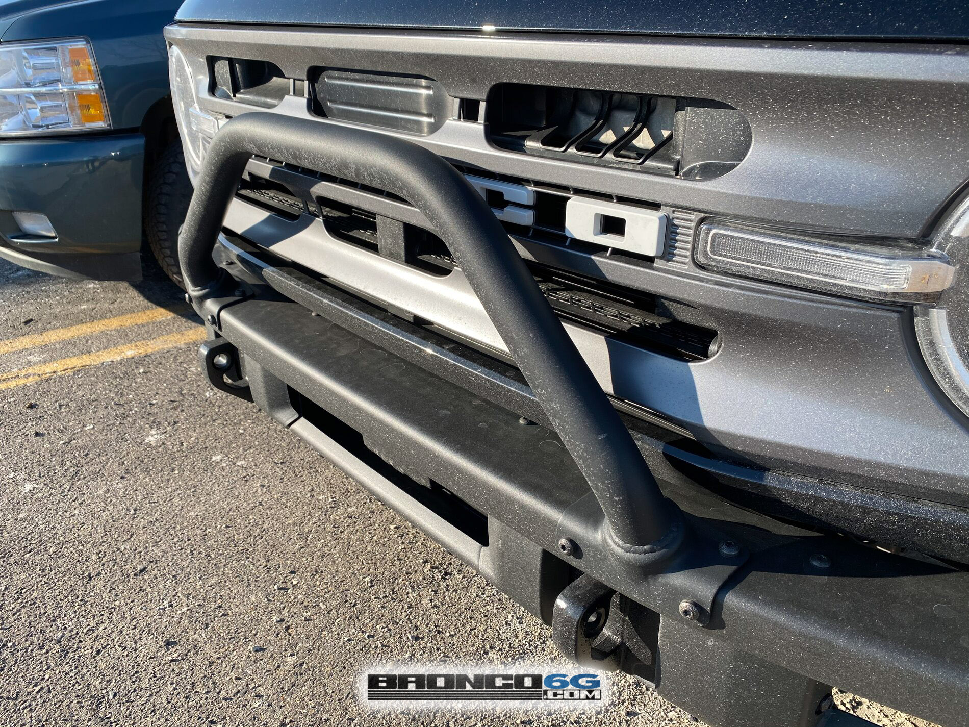 Ford Bronco Behind the grille... What is the blocked off area all about? (Answer: Hood latch) 1619385542068