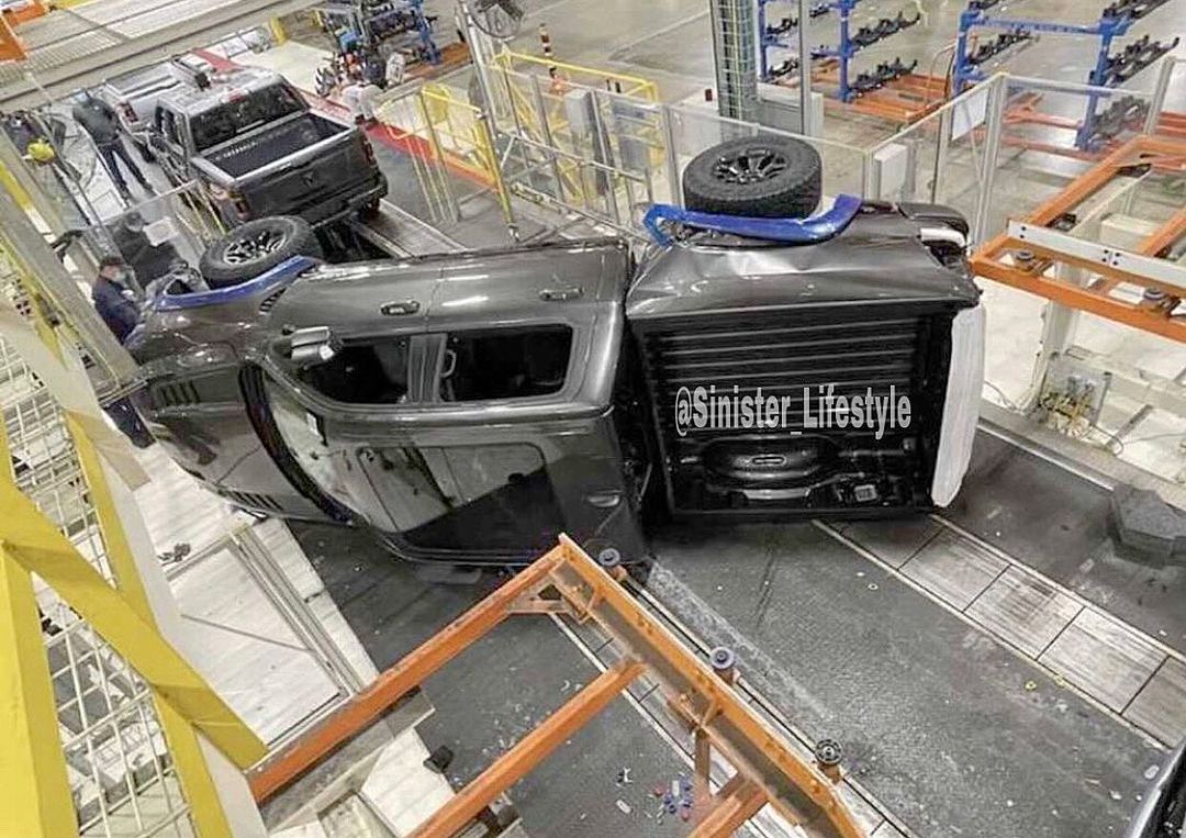 Ford Bronco Ooops!!!!!!!!!!!!!!! That is going to hurt!!!!!!!!!!!!!!!! TRX goes down for the count!!!!!!! 2021-ram-trx-inexplicably-falls-on-driver-s-side-on-the-assembly-line-153819_1