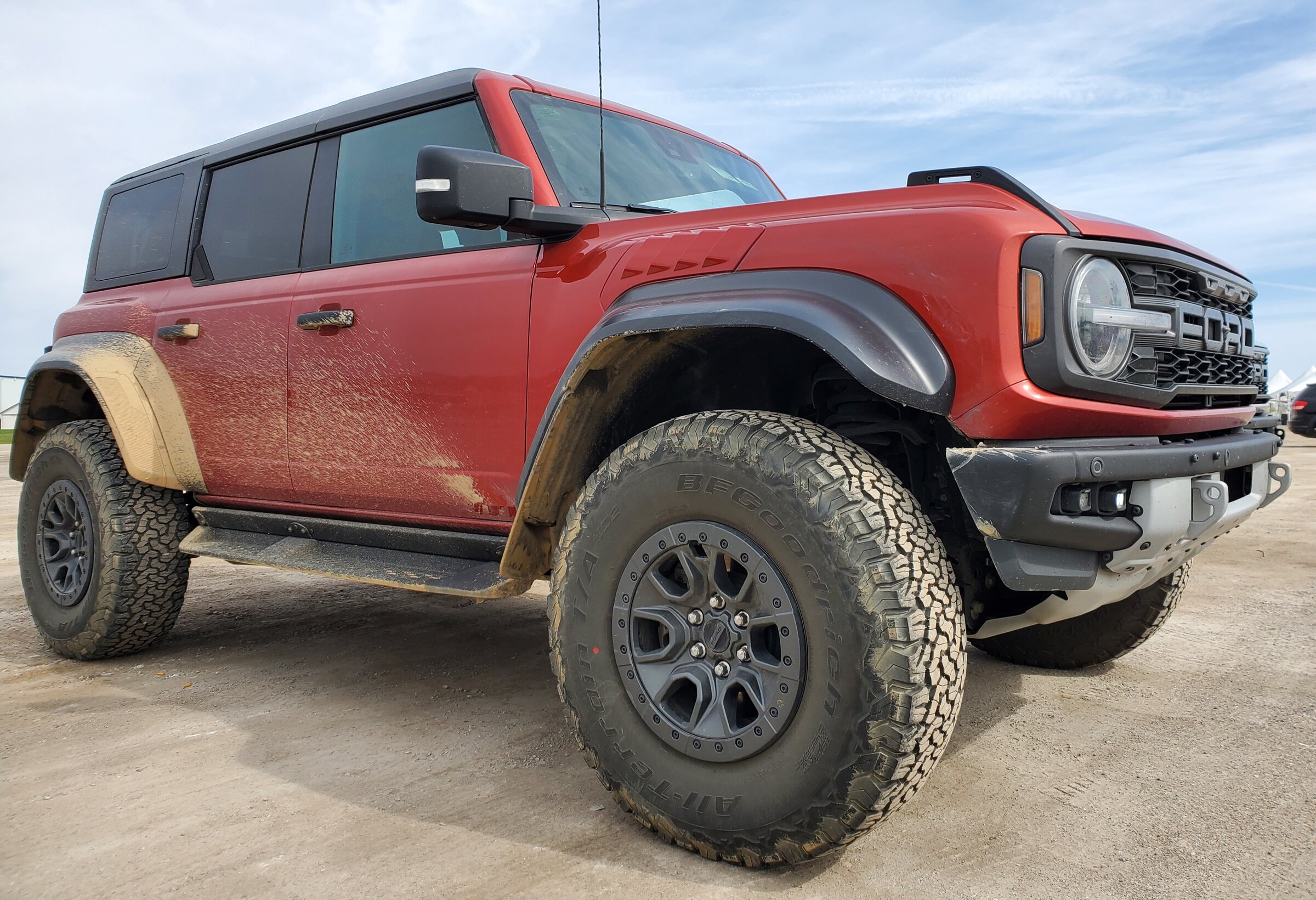 Ford Bronco 2 raptors in Port Huron today - Iconic Silver & Hot Pepper Red 20220430_103752