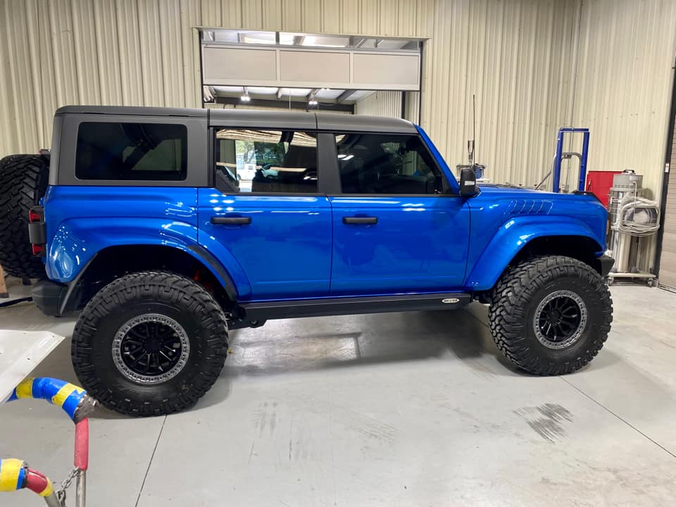 Ford Bronco Velocity Blue Bronco Raptor on RPG perch collar lift, 38's and painted flares 1677602373006