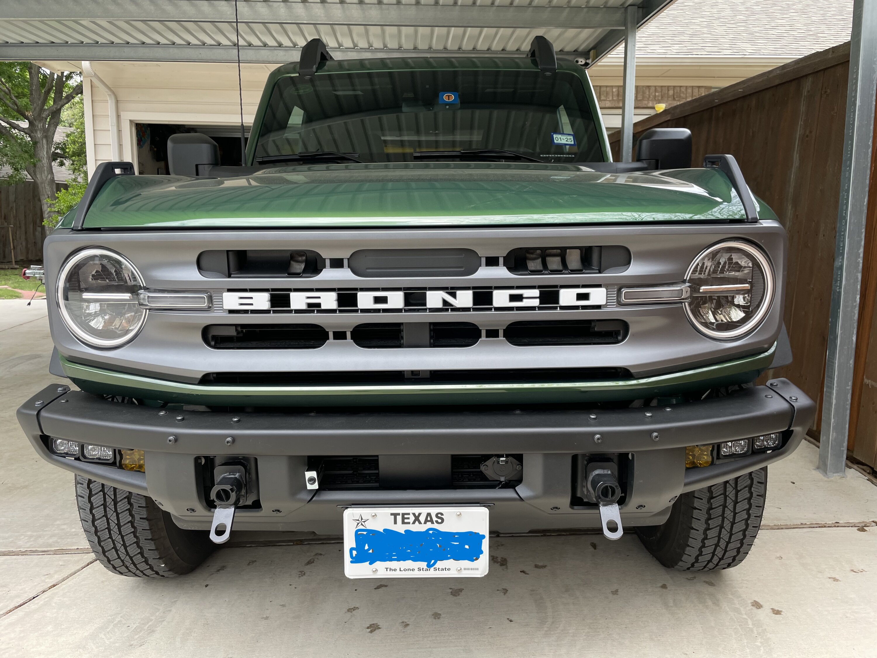 Ford Bronco Dealer installed license plate bracket into the grill Bill Flat Tow Front Picture.JPG