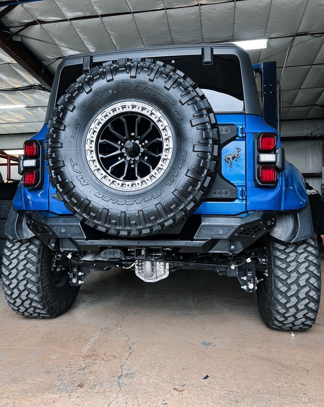 Ford Bronco Velocity Blue Bronco Raptor on RPG perch collar lift, 38's and painted flares 1677602373006