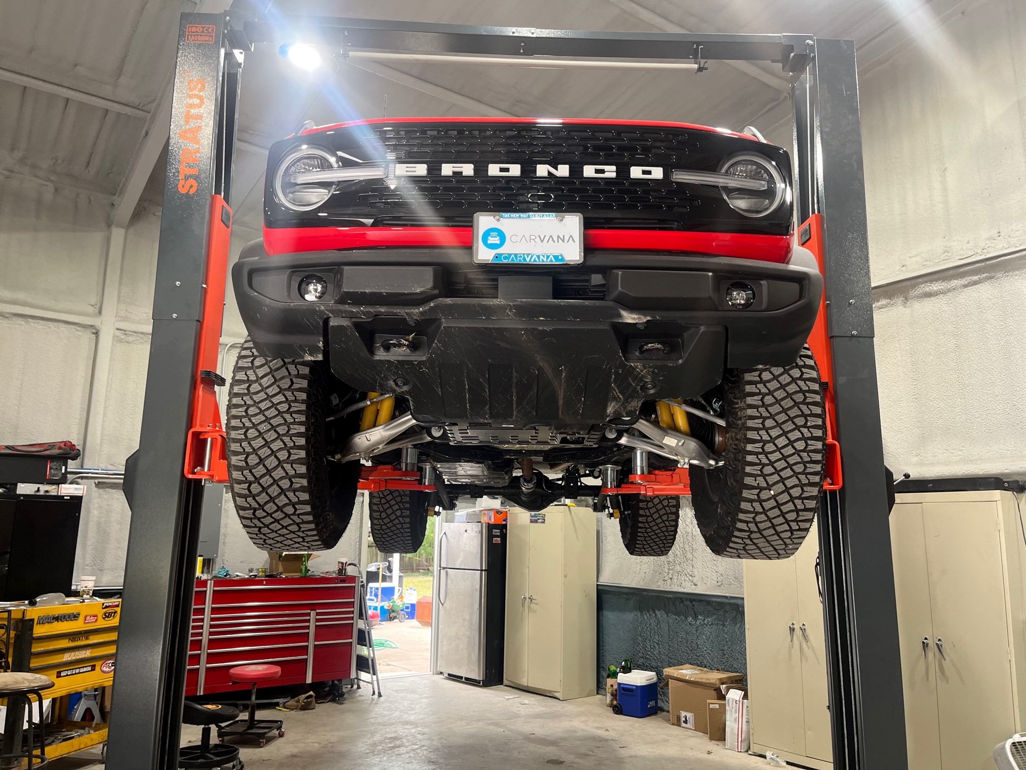 Ford Bronco 2 Door Race red Wildtrak build.  Custom FAB and CNC machining! On lift