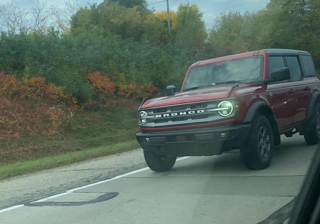 Ford Bronco Spotted in Wild: Rapid Red Big Bend & Cyber Orange Outer Banks Broncos Rapid Red Big Bend 2021 Bronco on the road in the wild real life 1