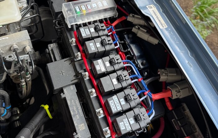 Relays mounted to fuse box cover